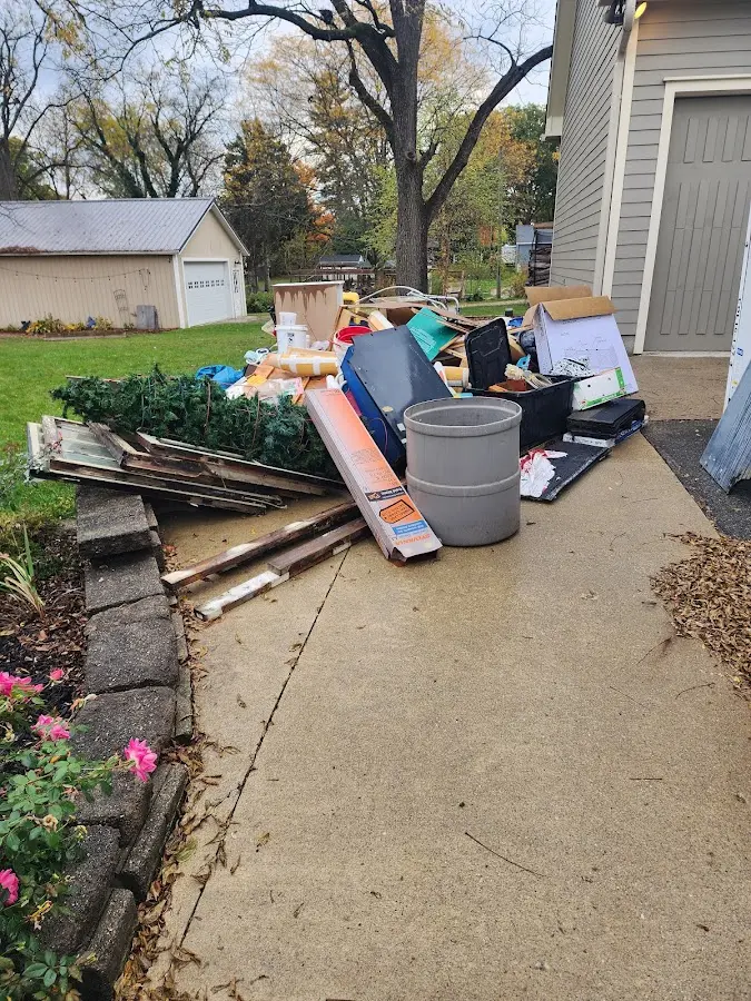 Dumpster being loaded with debris for 10 Yard Dumpster Rental in Eastchester